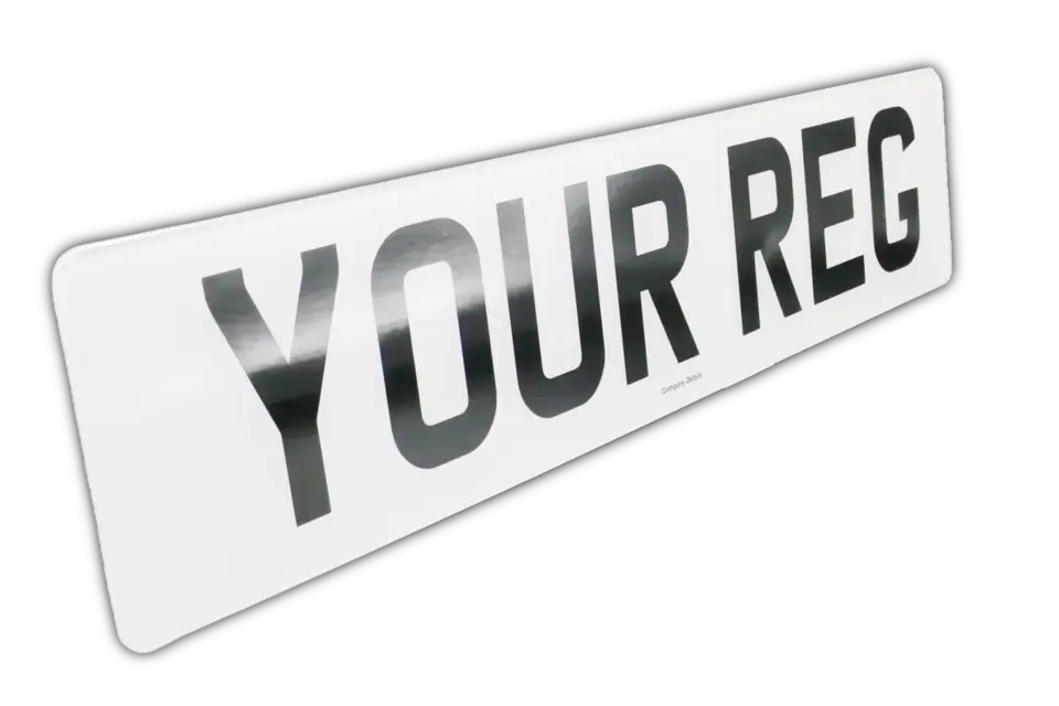 Flat black printed digits on a white number plate.