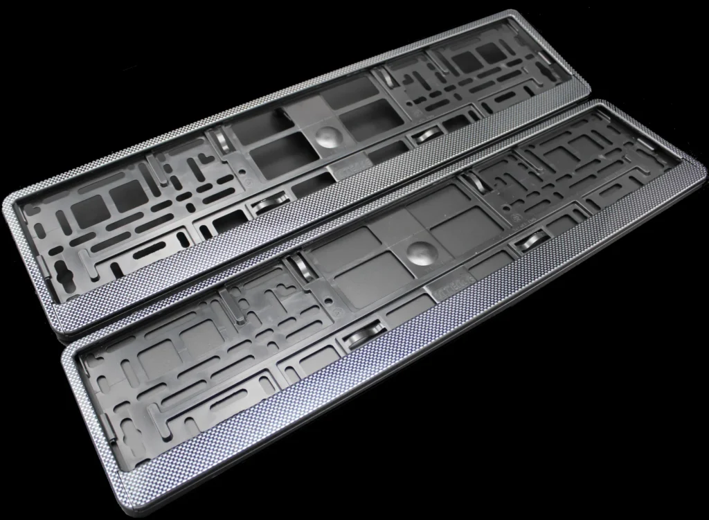 Pair of Carbon effect number plate holders for cars.